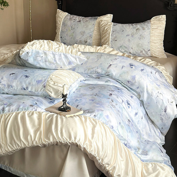 Elegant satin bedding set with watercolor floral pattern, ruffles and gathered pillowcases