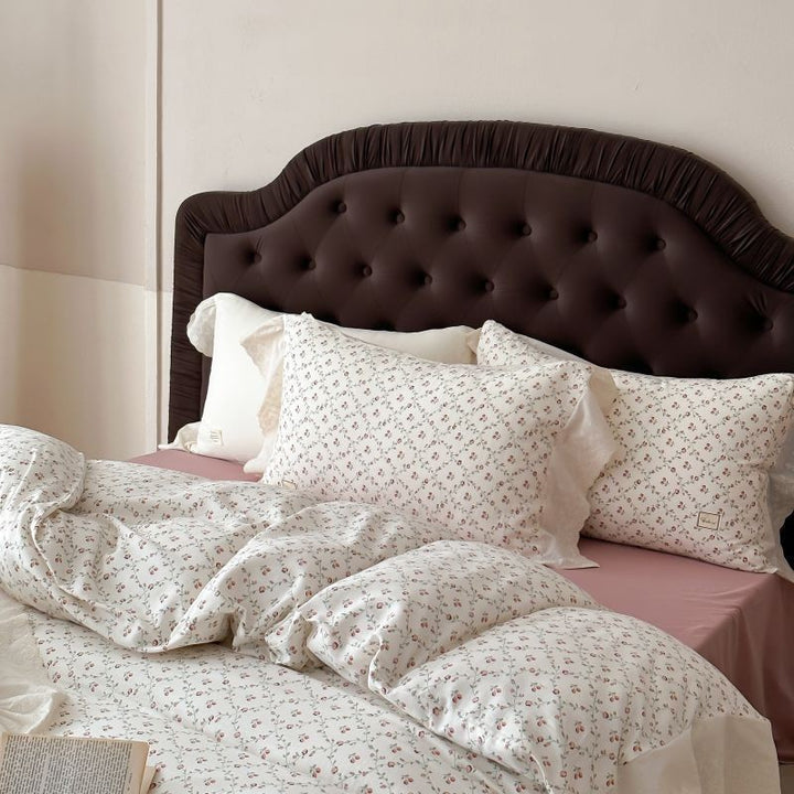 Luxurious cotton satin bed linen set in vintage style with delicate floral pattern and lace trim