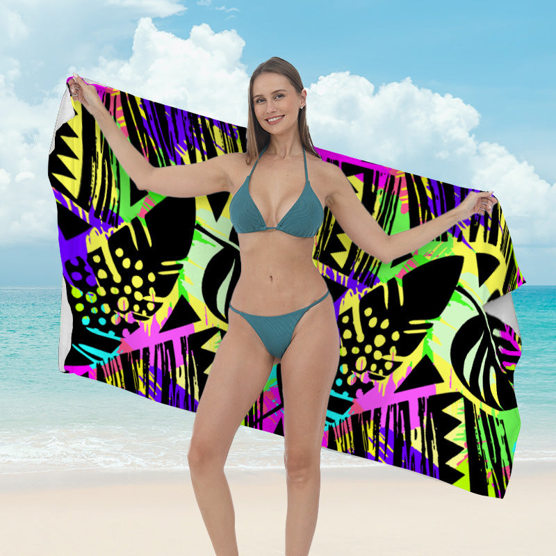 Beach towel with vibrant tropical plant motif Kalsten