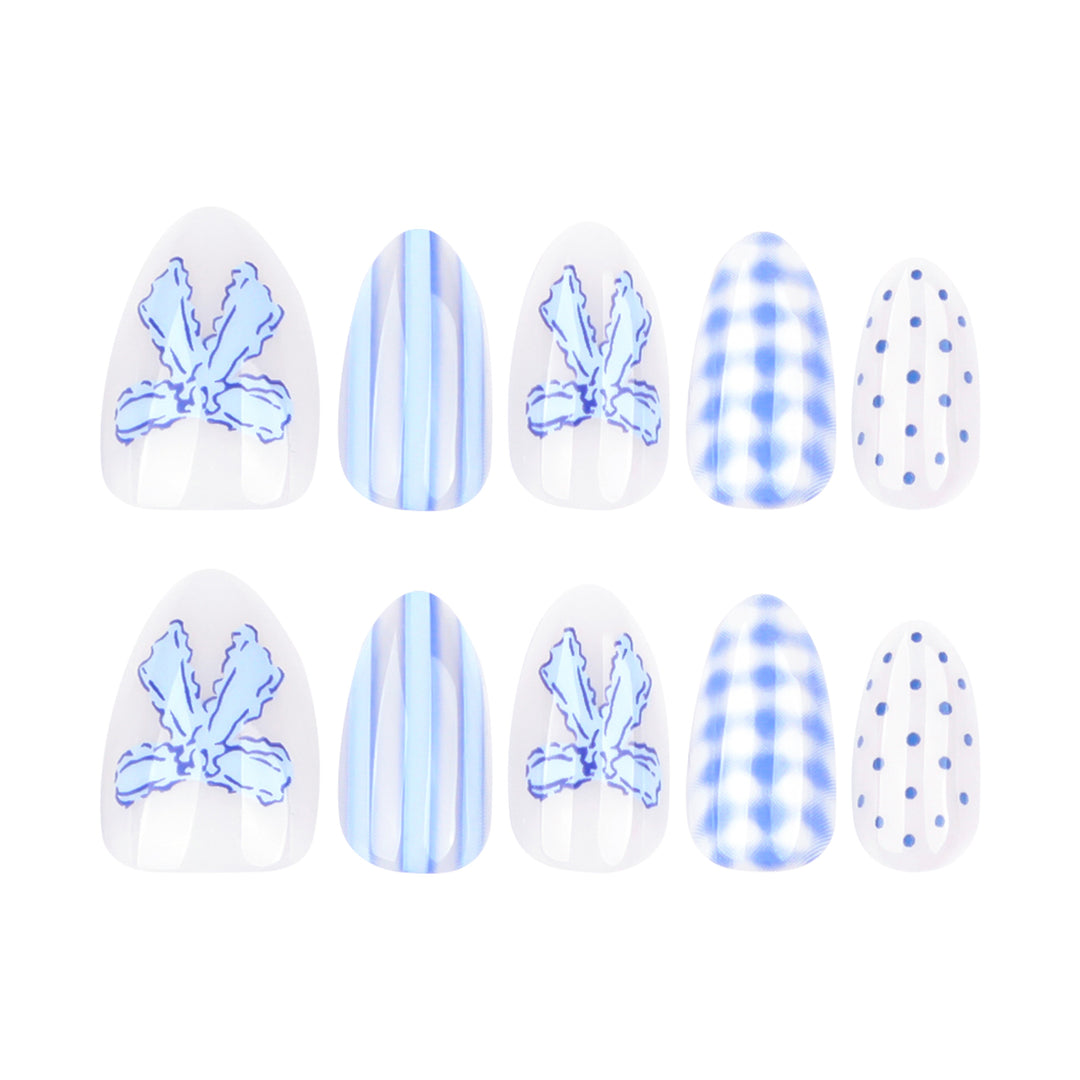 Artistic Nail Art with Floral and Polka Dot Designs Kalsten