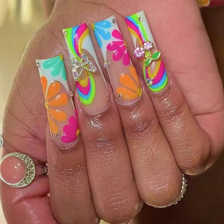 Artificial nails with colorful floral patterns and decorative accents Kalsten