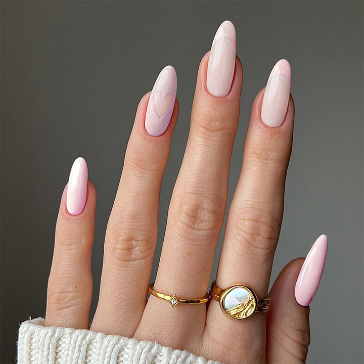 Artful stiletto nails with heart-shaped accents Kalsten
