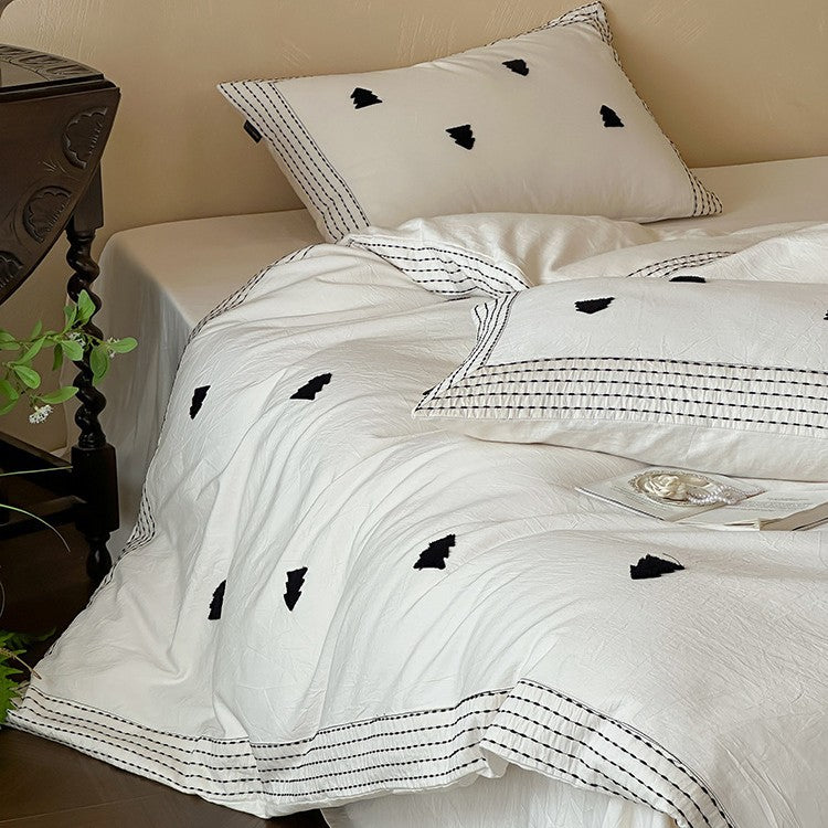 Linen-cotton blend duvet cover set with embroidered accent motifs and striped border