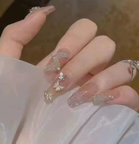 Elegant nail design with pearl embellishment Kalsten