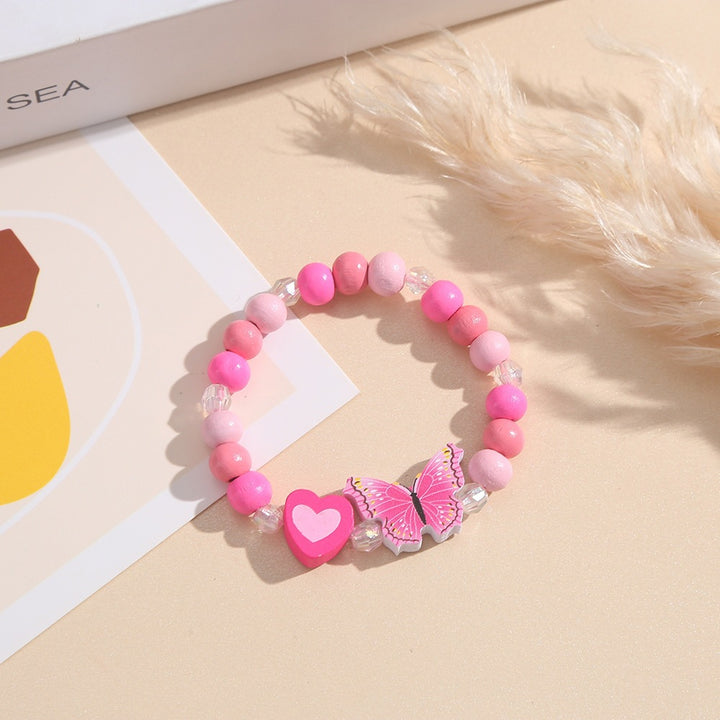 Playful bracelet with heart and butterfly charms Kalsten