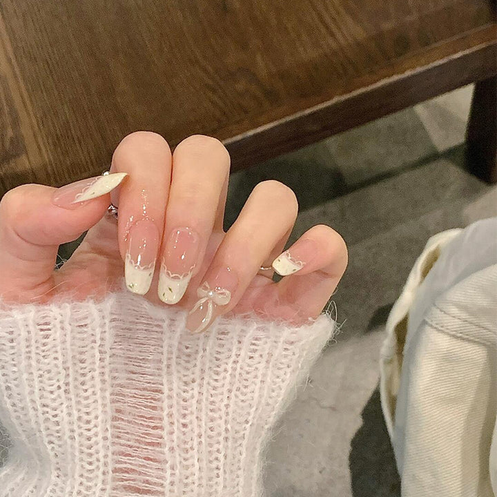 Artificial nails with elegant tip embellishment and romantic details Kalsten
