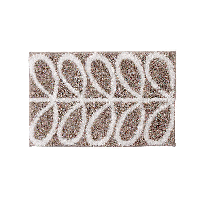 Fluffy bath mat in a graphic wave relief with anti-slip base Kalsten
