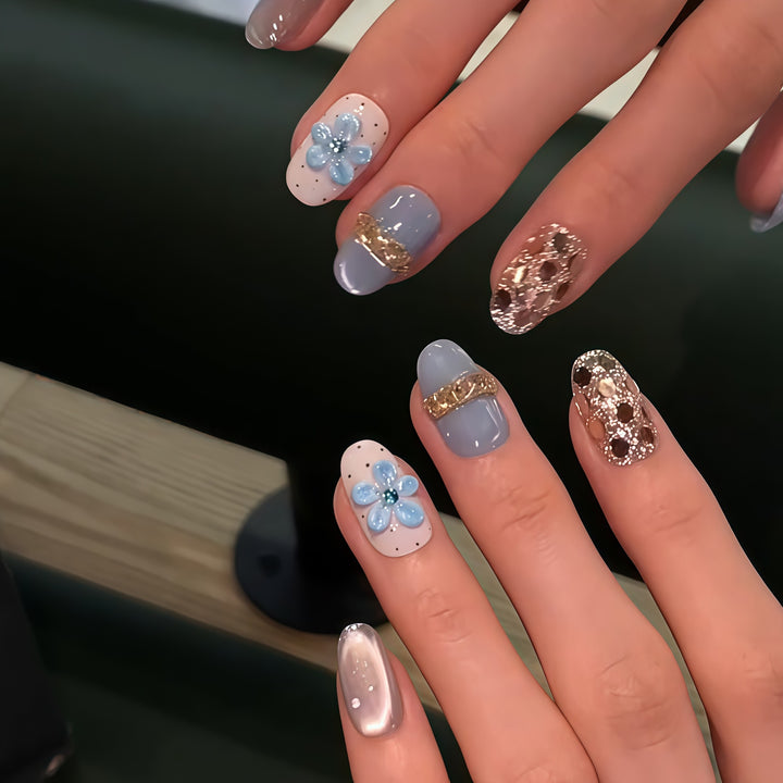 Artificial nails with luxurious glitter details and floral accents Kalsten