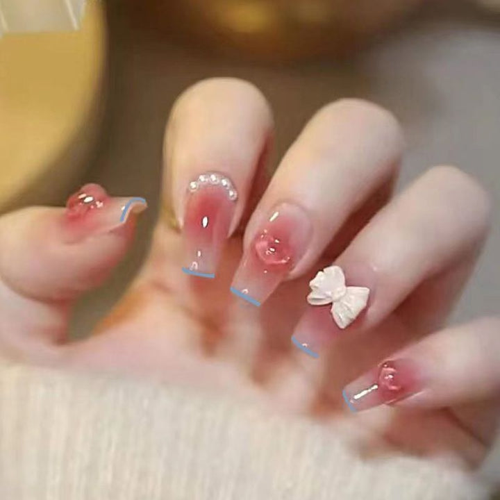 Artistic Nail Art with Glitter and Flower Applications Kalsten