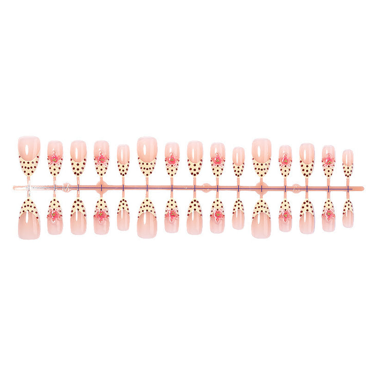 Acrylic nail set with romantic dots and floral accents Kalsten