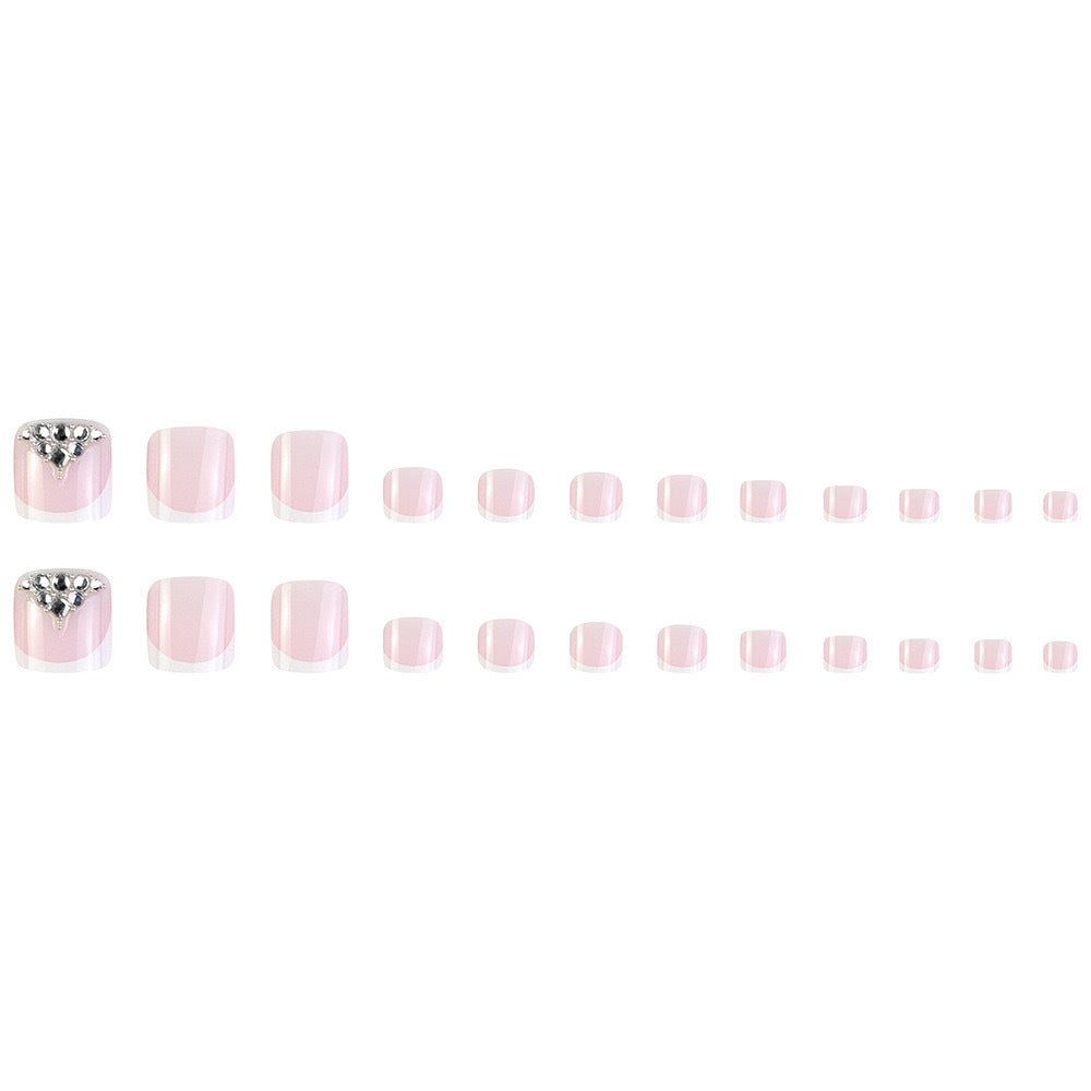 Nail art set with elegant French tips and sparkling rhinestone details Kalsten