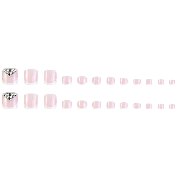 Nail art set with elegant French tips and sparkling rhinestone details Kalsten