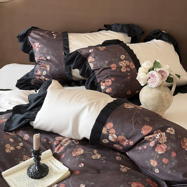 Reversible cotton satin bedding set with floral design and decorative ruffle trim