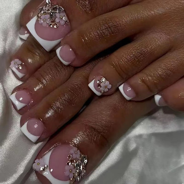 Acrylic nail set with elegant 3D flowers and glitter accents Kalsten