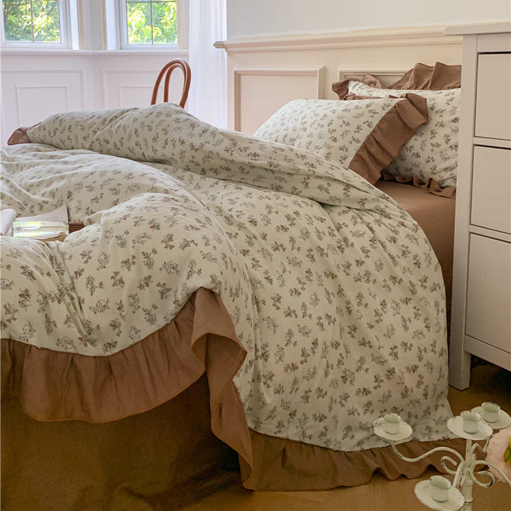 Romantic bed linen complete set made of cotton percale with delicate floral print, ruffle trim, and silky-matte finish