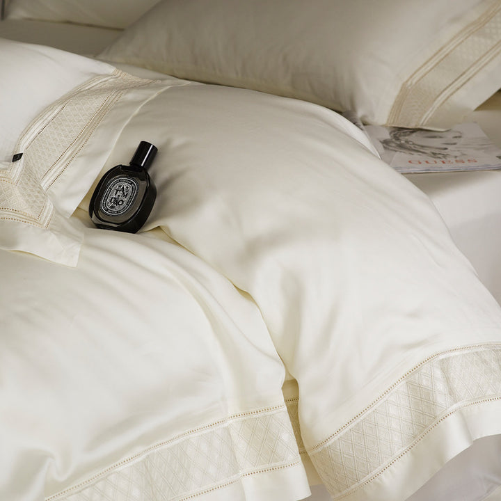 Silky flowing satin bed set with decorative cassette border and extra soft touch