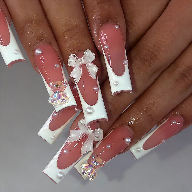 Elegant artificial nails with delicate bows and pearls Kalsten