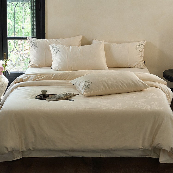 Luxurious satin bedding set with delicate floral embroidery