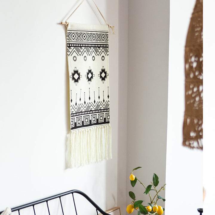 Woven cotton blend wall hanging with graphic ethnic pattern and long fringes Kalsten