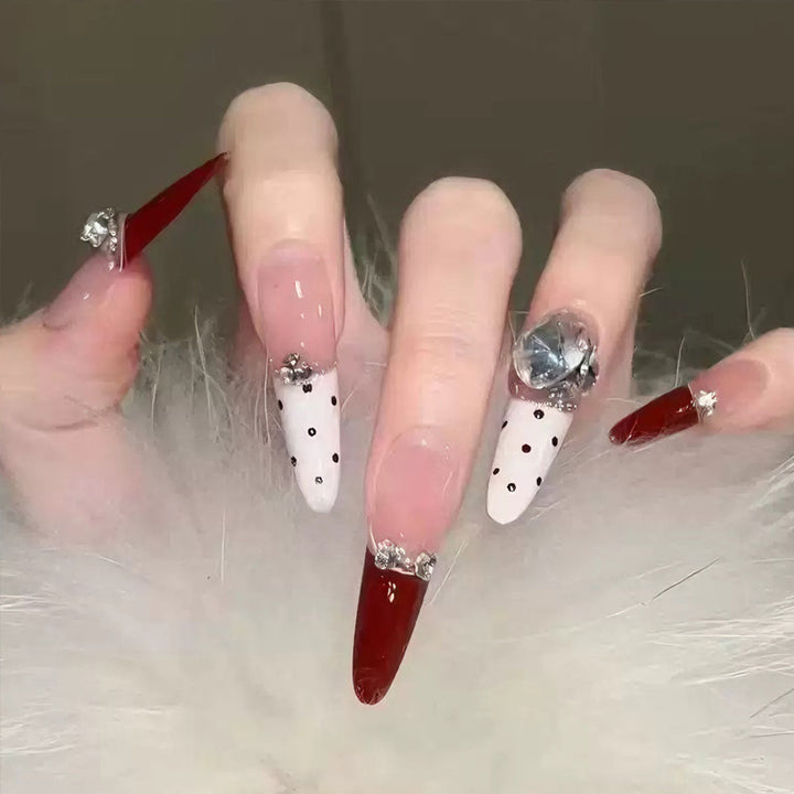 Artificial nail set with festive gift design and elegant glitter accents Kalsten