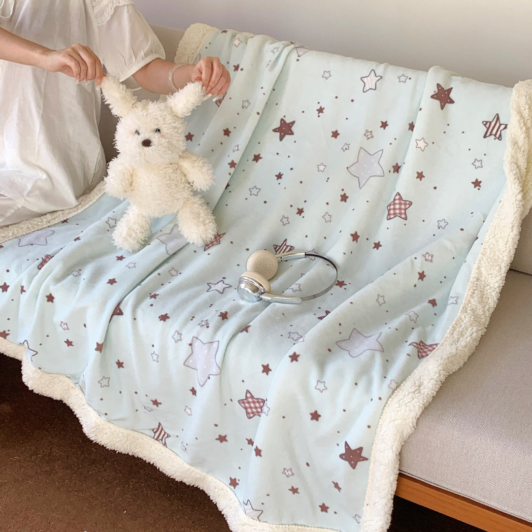 Reversible fleece blanket with cartoon cat design and teddy lining