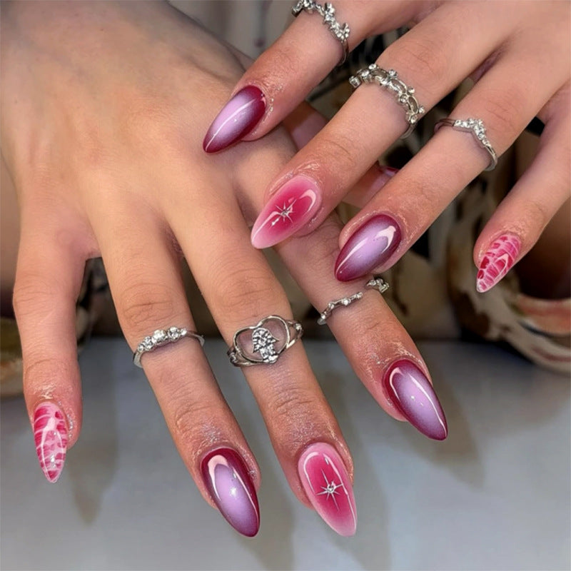 Artistic stiletto nails with elegant gradient and delicate accents Kalsten