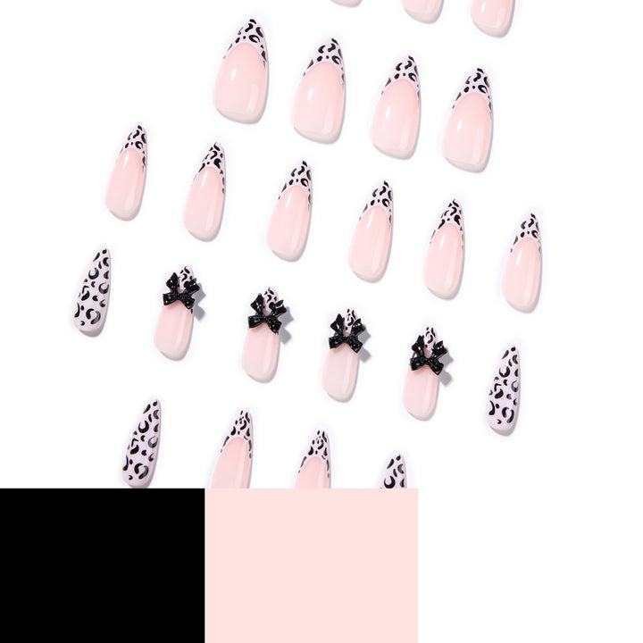 Artful Stiletto Nails with Leopard Print and Bow Accent Kalsten