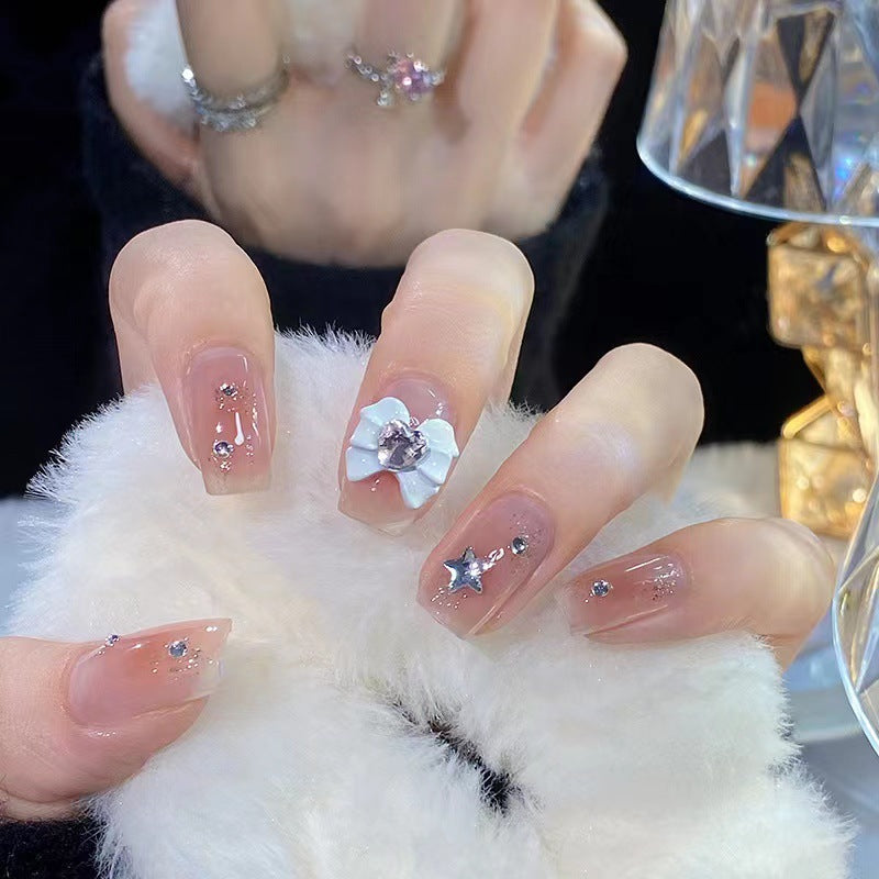 Artistic nail tips with floral and glittering accents Kalsten