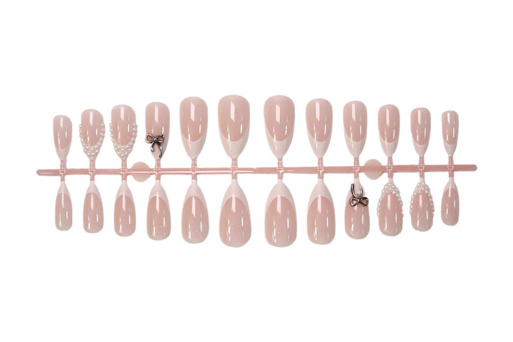 Glamorous artificial nail set with elegant bows and glitter accents Kalsten