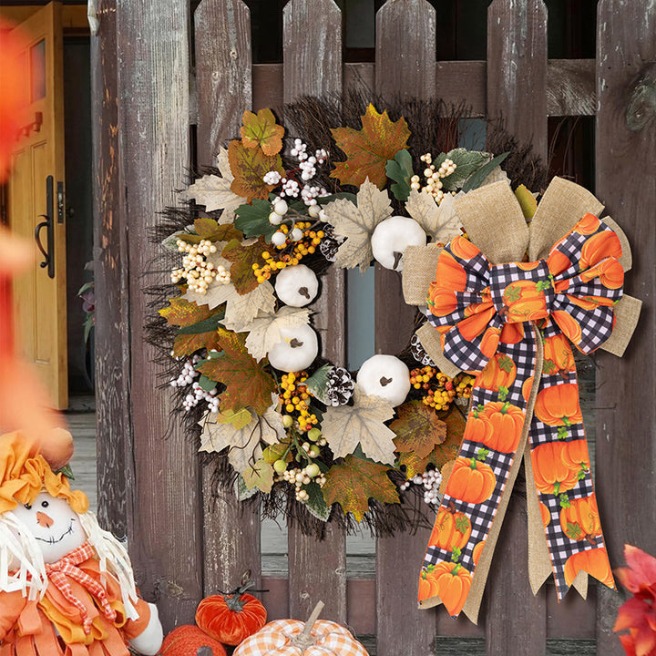 Large autumn door bow made of jute with pumpkin print and gingham ribbons