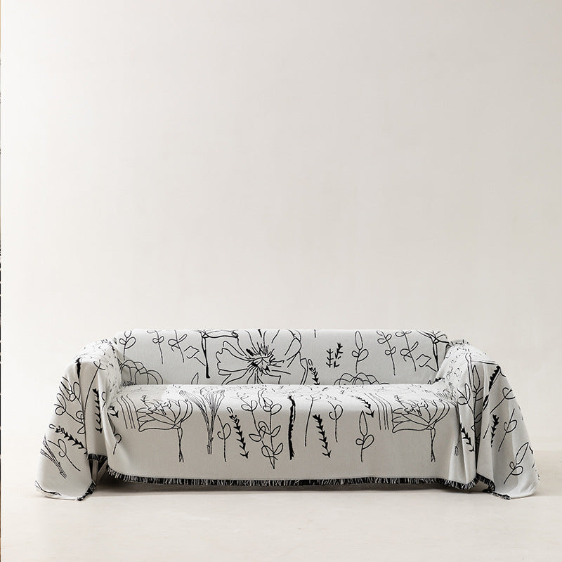 Fine woven sofa cover and furniture throw with floral line drawing and decorative fringed edge Kalsten