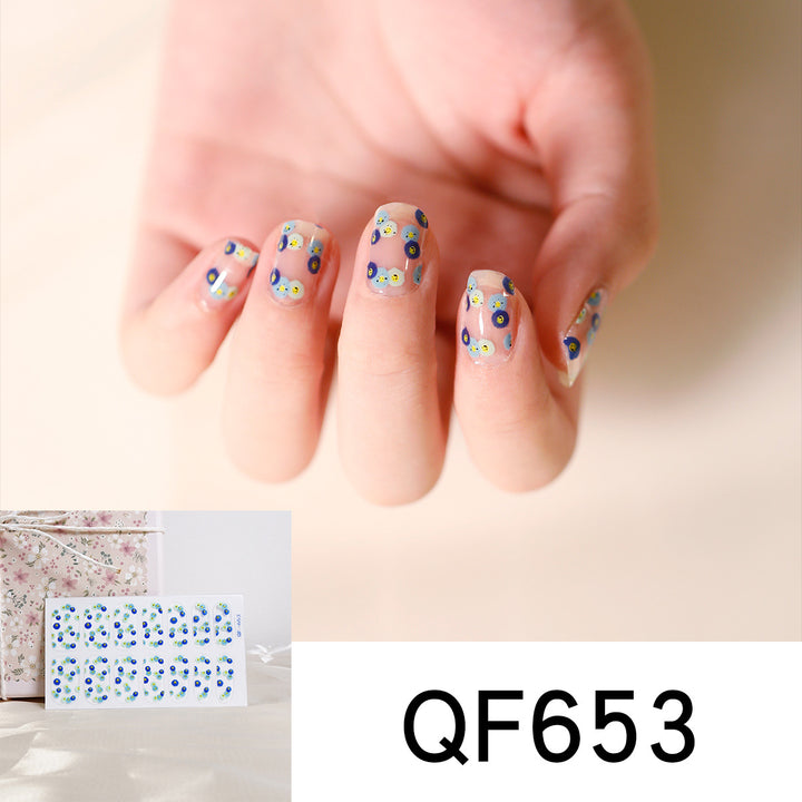 Artificial nail art with heart-shaped designs and soft color gradients Kalsten