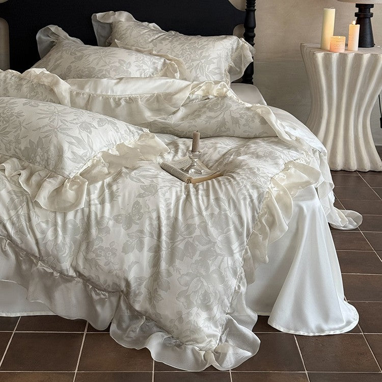 Elegant bedding set made of fine satin jacquard with delicate floral relief and decorative ruffle
