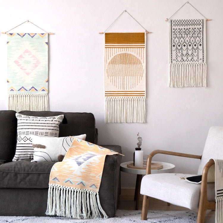 Woven Boho wall tapestry in Ethno design with long fringes and wood stick Kalsten