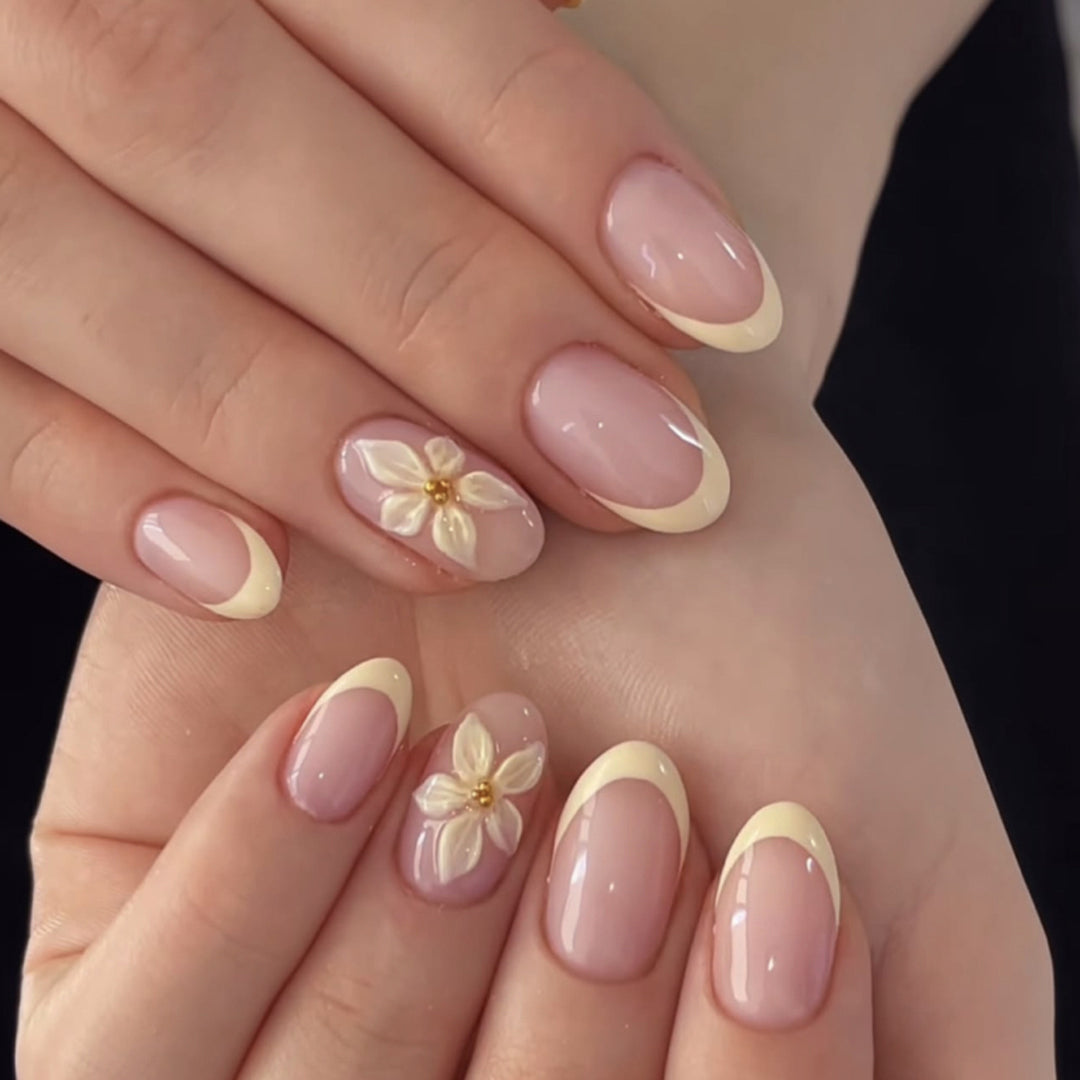 Artful stiletto nails with elegant floral design and glitter details Kalsten