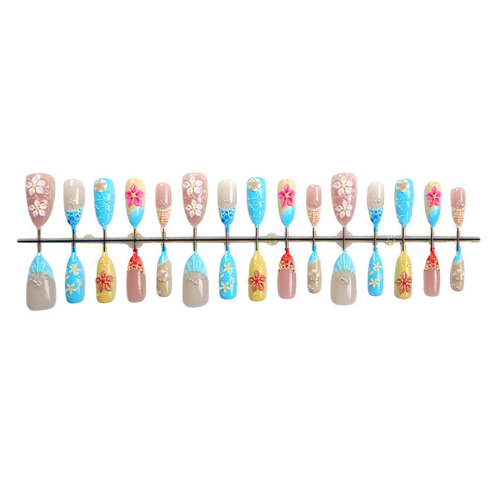 Elegant artificial nail set with floral details and glitter accents Kalsten