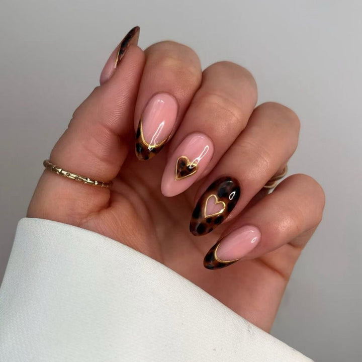 Artful stiletto nails with elegant heart design Kalsten