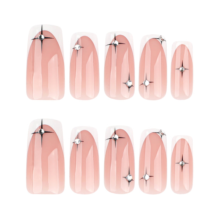 Artificial nail extensions with elegant French tip and glitter accents Kalsten