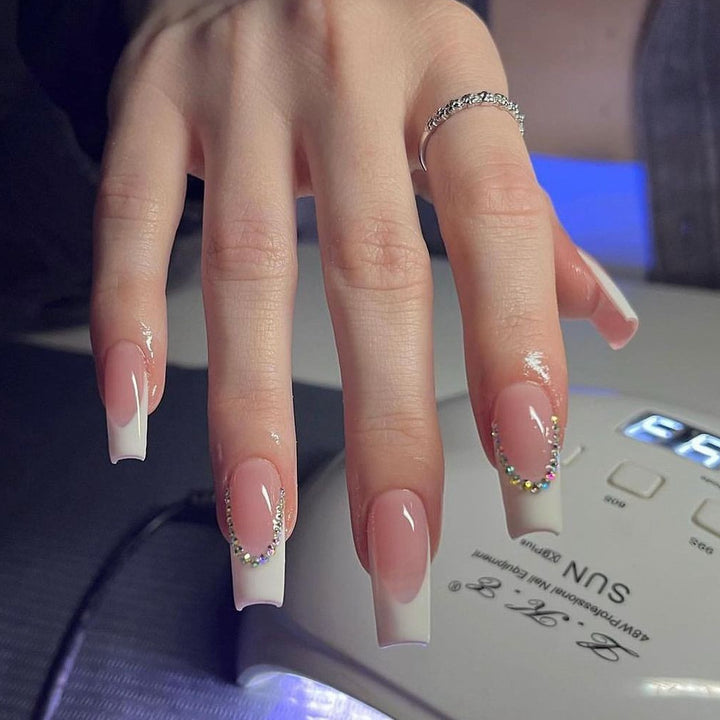 Elegant French Tip Acrylic Nail Extensions with Rhinestone Accents Kalsten