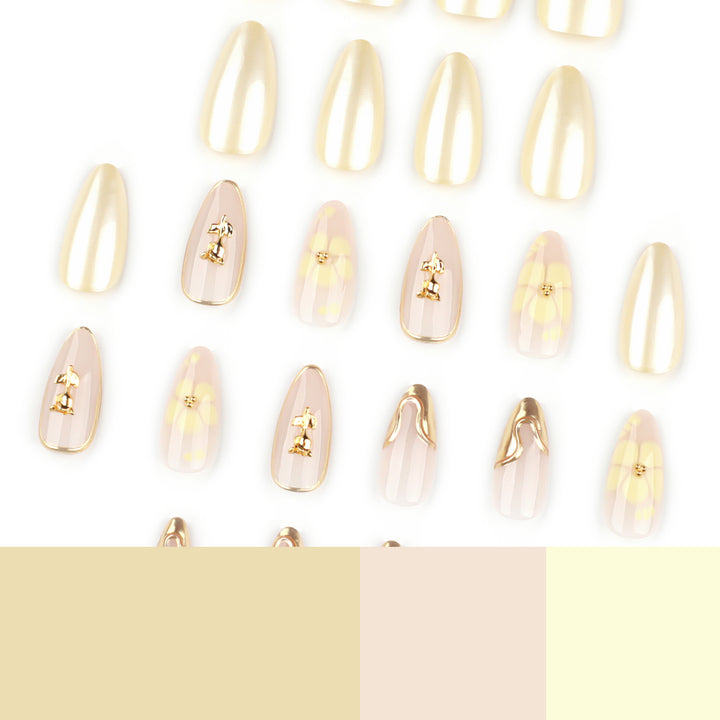 Artful nail art with floral decorations and glitter accents Kalsten