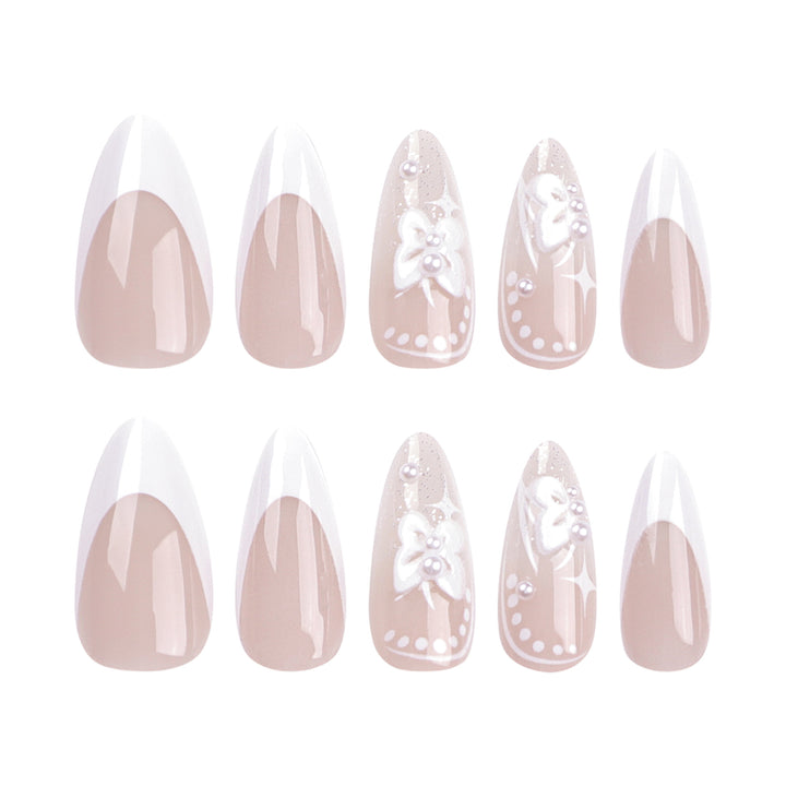 Artful stiletto nails with floral designs and glitter accents Kalsten