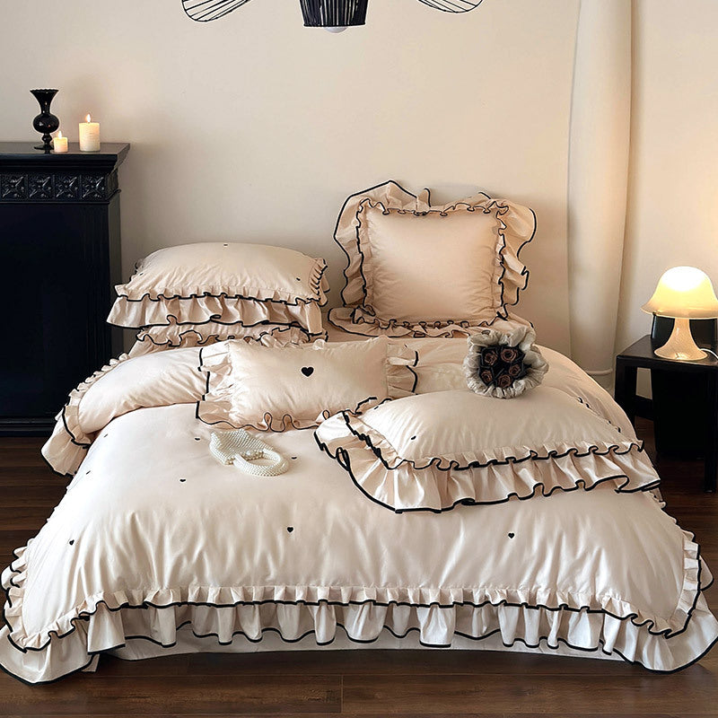 Cotton satin bed set with double-layer ruffled trim, contrast edge and heart embroidery