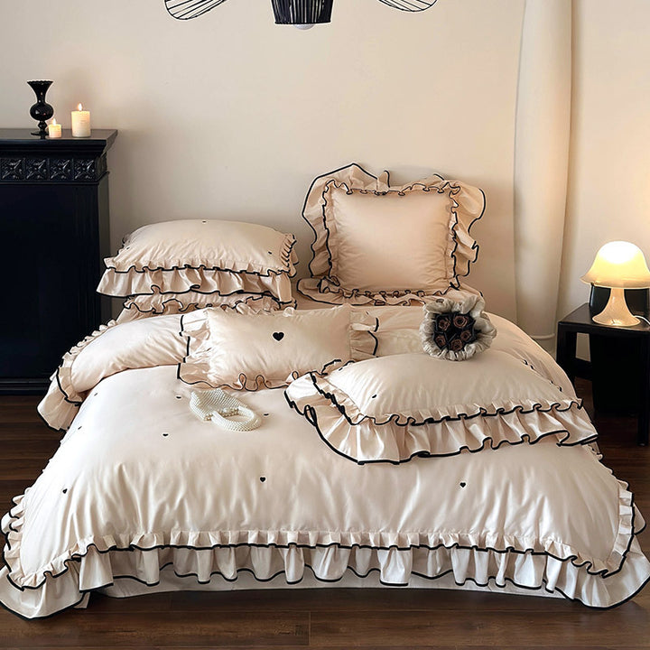 Cotton satin bed set with double-layer ruffled trim, contrast edge and heart embroidery