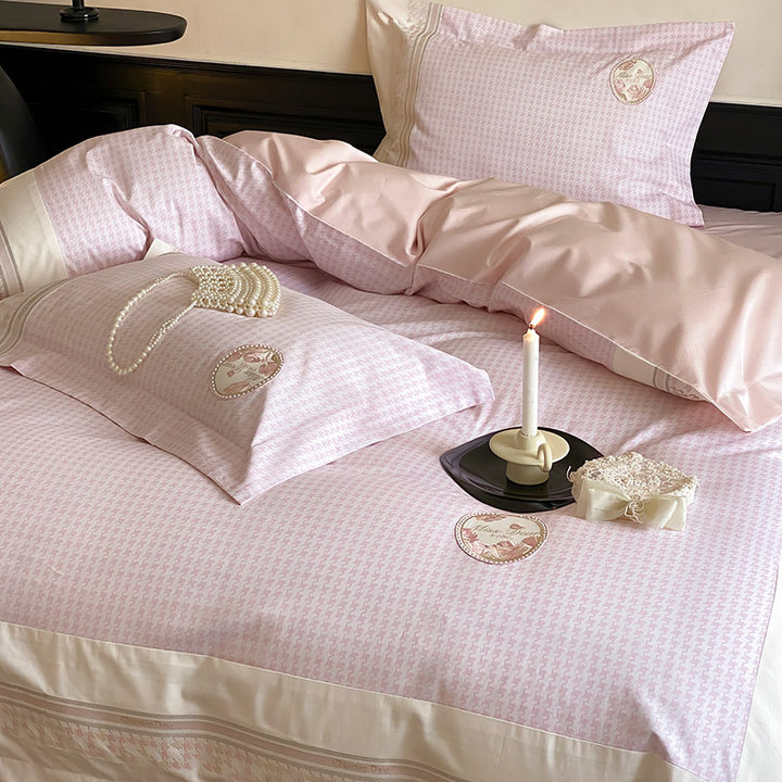 Luxurious cotton satin bedding set with embroidered medallion applications and fine edging