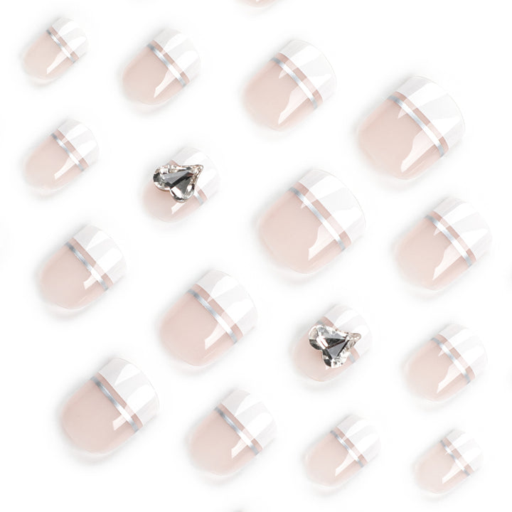 Elegant Nail Art with Glitter Accents and Jewelry Details Kalsten