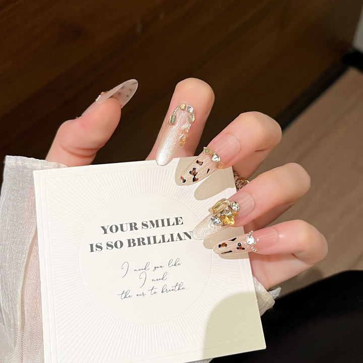 Artistic Stiletto Press-On Nail Art with Glimmering Accents Kalsten
