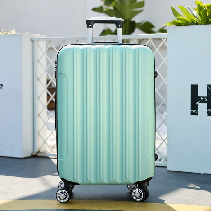 Hard shell suitcase with 360-degree wheel system and integrated safety feature Kalsten