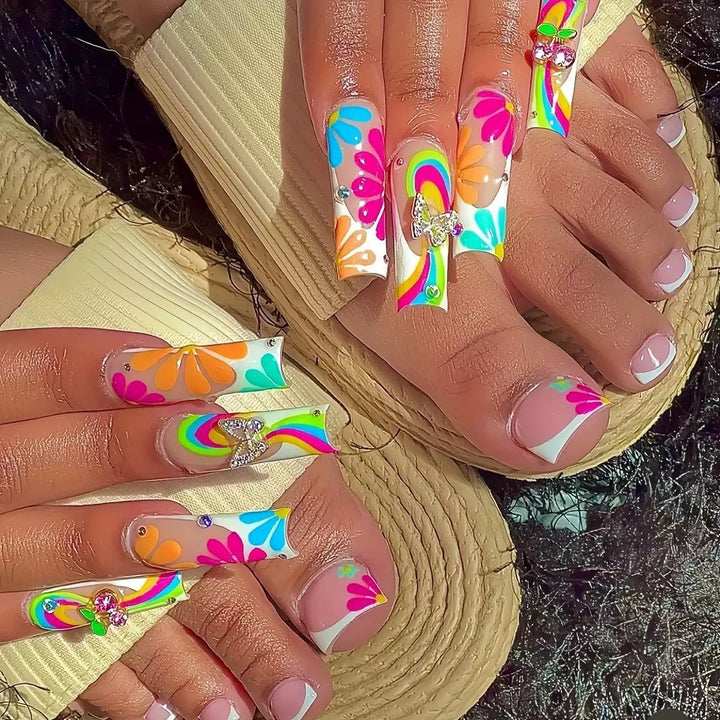 Nail art set with glowing flower motifs and glitter accents Kalsten
