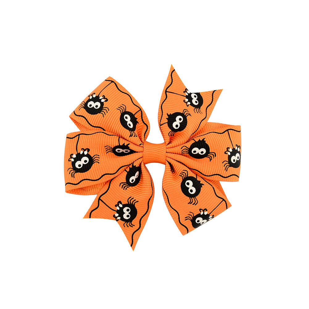 Halloween bow with pumpkin and witch motifs