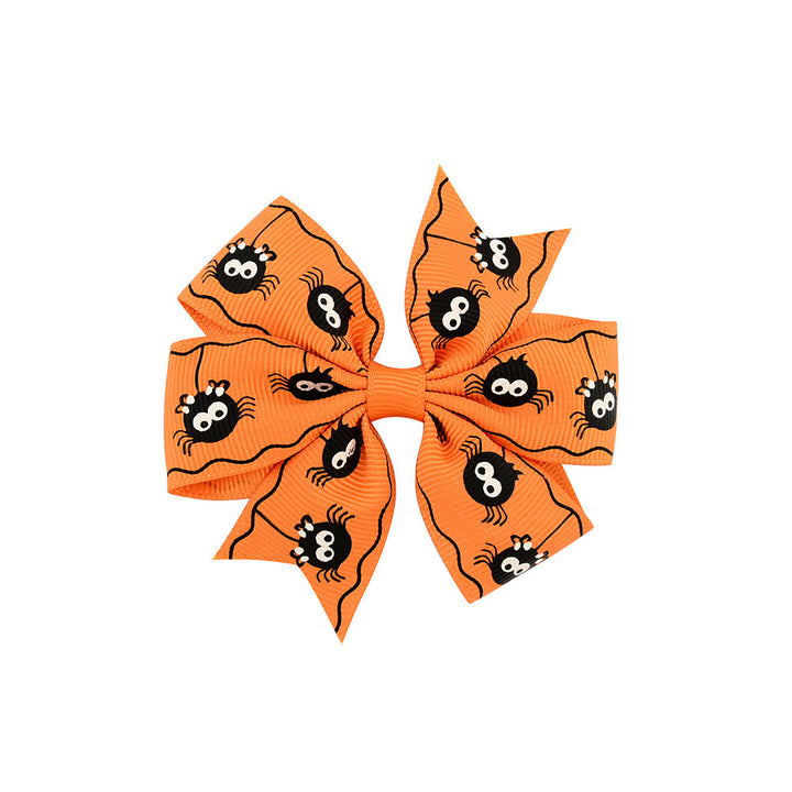 Halloween bow with pumpkin and witch motifs